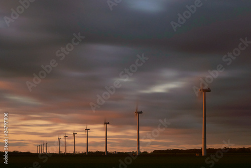 Alternative clean energy is a must these days. Here we see wind parks with many wind turbines in a landscape