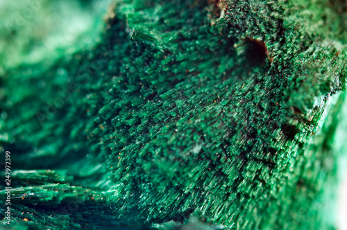 Green beautiful background of natural mineral Malachite. Macro