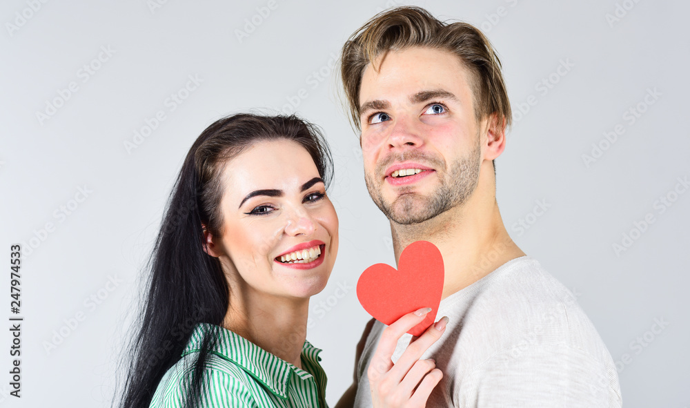 Man and girl in love. Romantic ideas celebrate valentines day. Happy together. Man and woman couple in love hold red paper heart valentines cards. Valentines day and love. Valentines day concept