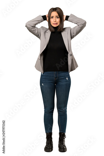 A full-length shot of a Young business woman frustrated and takes hands on head over isolated white background © luismolinero