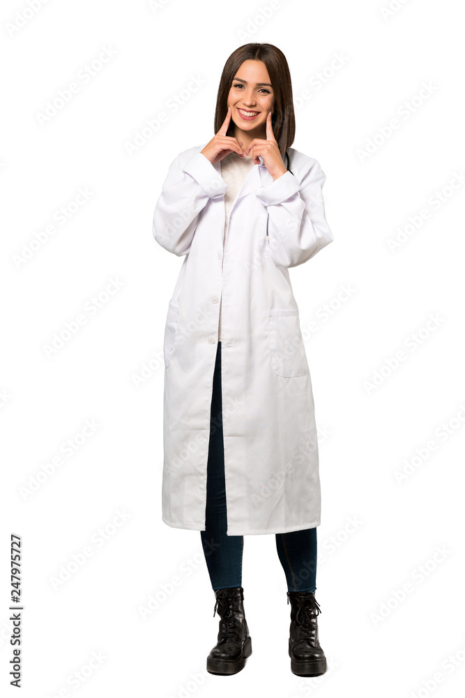 A full-length shot of a Young doctor woman smiling with a happy and pleasant expression over isolated white background