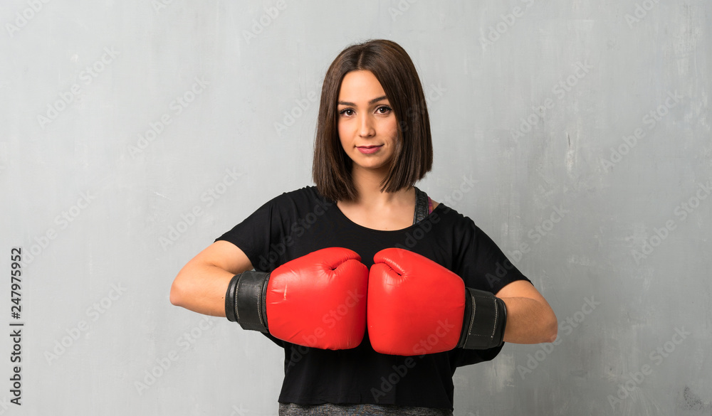 Young sport woman with boxing gloves Young sport woman with boxing gloves