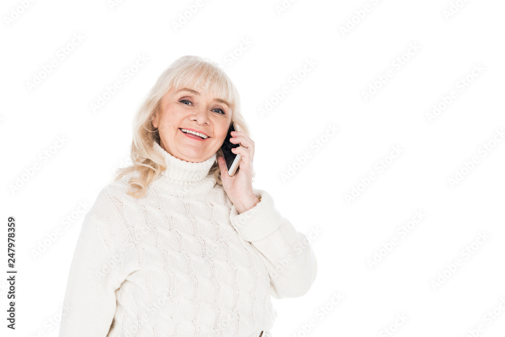 cheerful retired woman talking on smartphone isolated on white cheerful retired woman talking on smartphone isolated on white