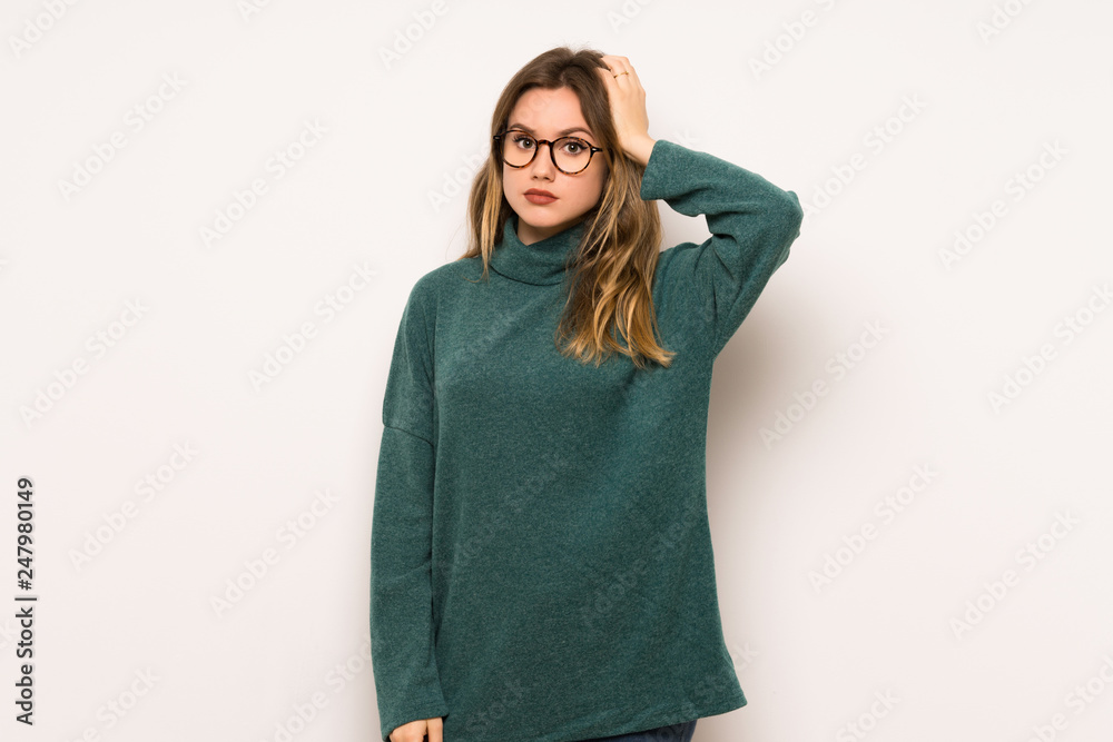 Fototapeta premium Teenager girl over white wall with an expression of frustration and not understanding