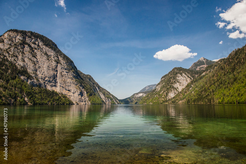 Beautiful panorama on Kenigssee lake.Colorful morning view of the Bavarian Alps on the border of Austria, Germany, Europe.Photo of beautiful landscape.Green water with montains.