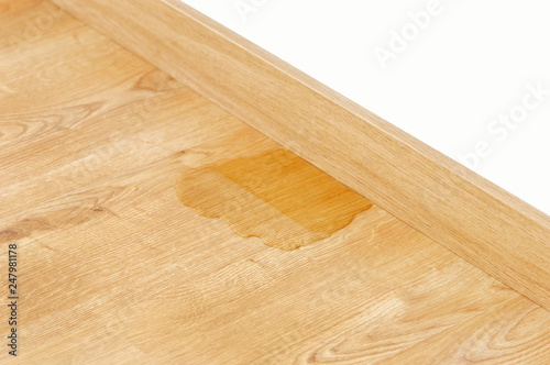 wood laminate parquet with water leak