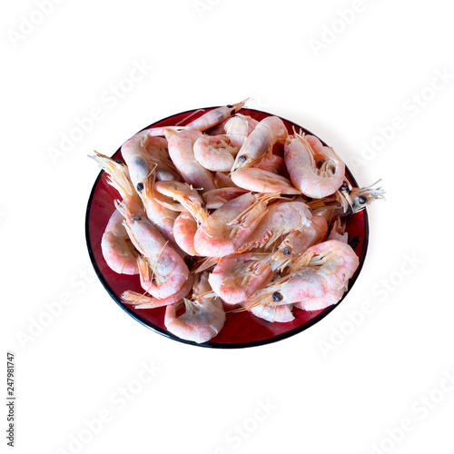 Boiled tiger shrimps, ready to eat on a platter. Isolated on white background.
