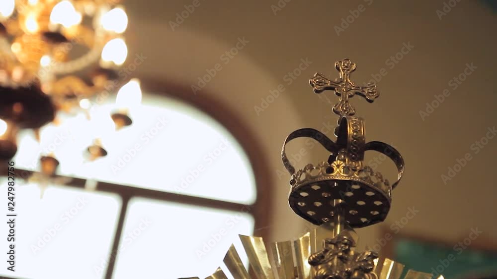Chandelier in the church against the background of the great iconostasis Chandelier in the church against the background of the great iconostasis
