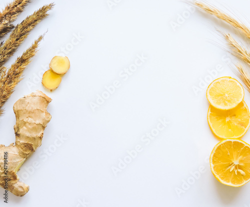 Lemons and ginger on a white background.Healthy food. Ginger Root Tea with Lemon. Healthy ingredients against cold.Top view image of lemon and ginger with copy space. get rid of toxins and boost.