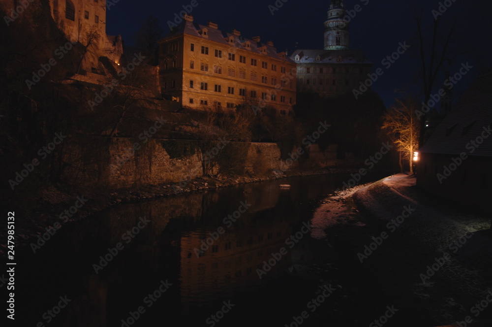 Cesky Krumlov Castle illuminated at night and reflected in the river, UNESCO heritage site of Czech Republic