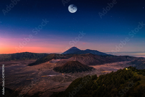 Mount Bromo volcano  Gunung Bromo  at sunrise with moon in Bromo Tengger Semeru National Park  East Java  Indonesia.  Elements of this image furnished by NASA 