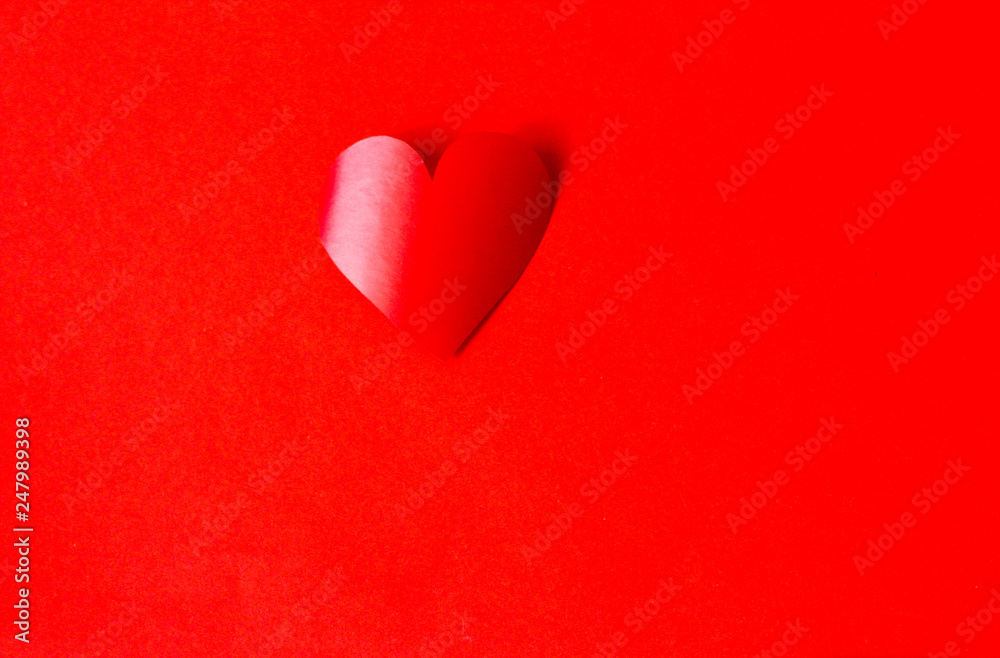 Valentine concept, perfect for card or banner - 3d red heart on the red background, selective focus, free copy space