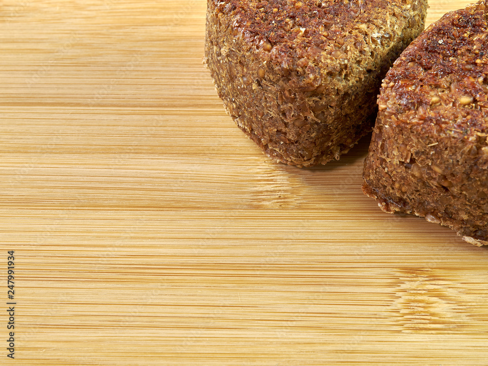 high-quality bread from sprouted wheat heart shape on a cutting board from a noble variety of Chinese bamboo. homebaked bread. healthy food. breakfast. copy space high-quality bread from sprouted wheat heart shape on a cutting board from a noble variety of Chinese bamboo. homebaked bread. healthy food. breakfast. copy space