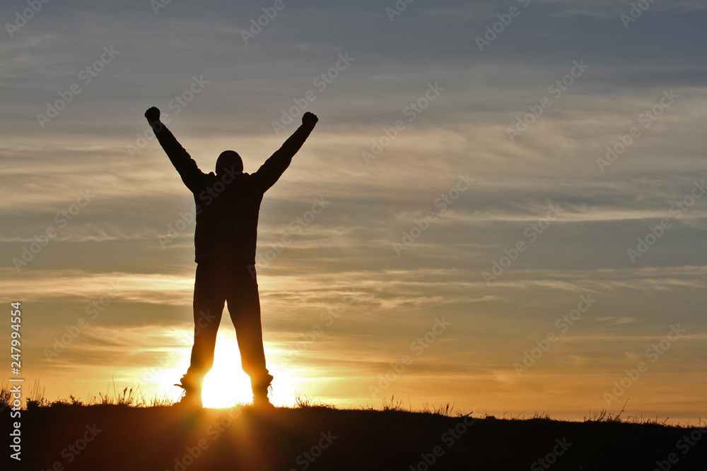 Man on sunset background