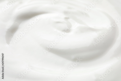 Delicious creamy yogurt as background, closeup view