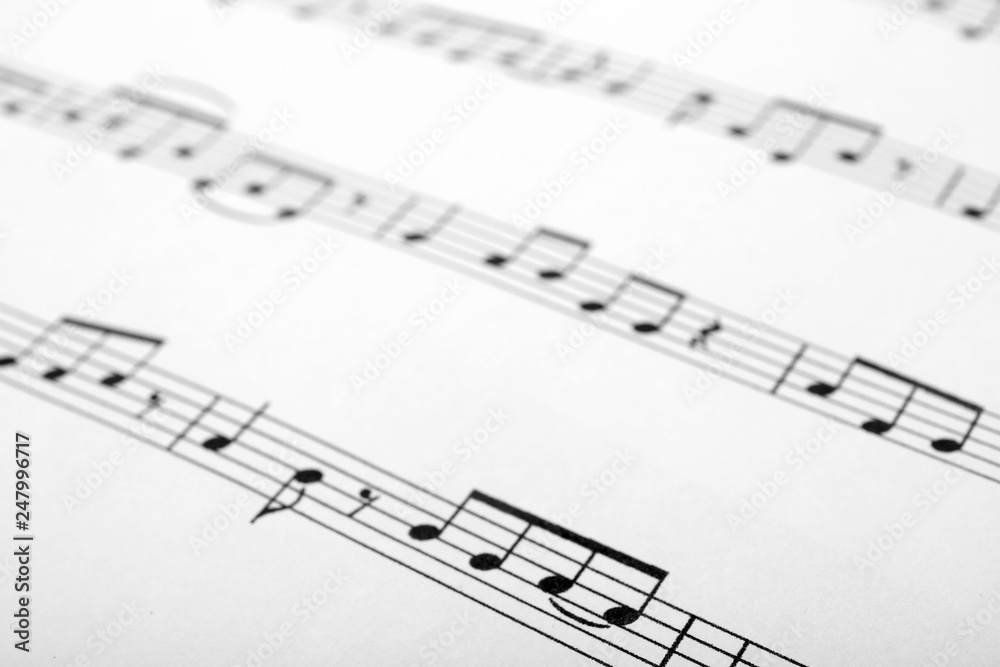 Sheet with music notes as background, closeup Sheet with music notes as background, closeup
