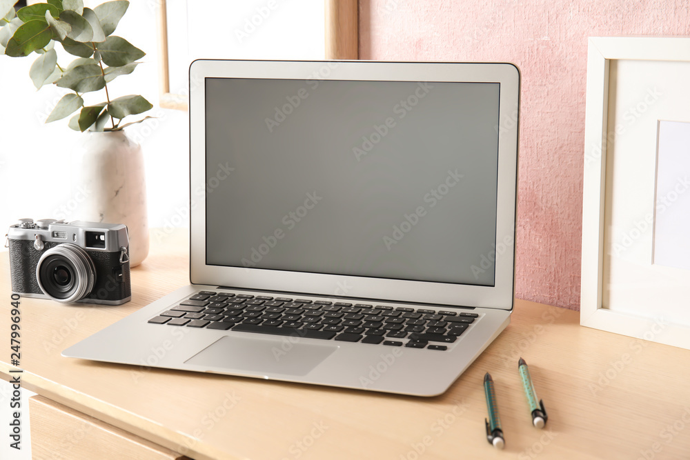 Fototapeta premium Cozy blogger workplace with laptop at home