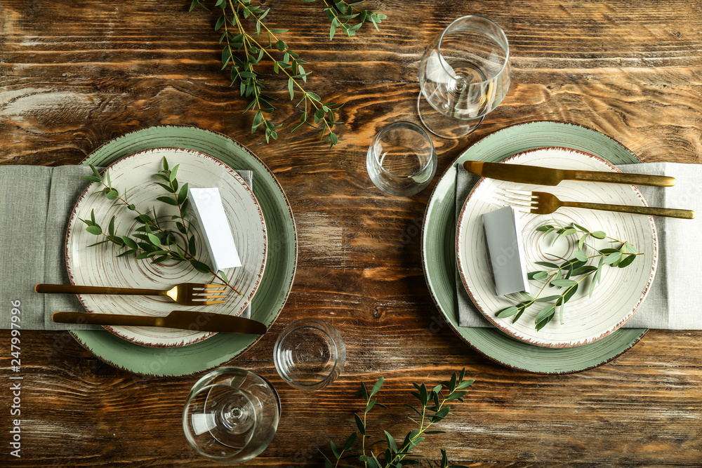 Simple table setting on wooden background - obrazy, fototapety, plakaty 