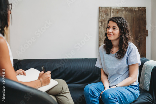 Psychotherapy session, woman talking to his psychologist in the studio