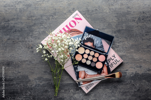 Magazine with makeup cosmet...