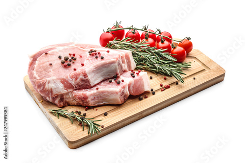 Wooden board with tasty raw meat and spices on white background