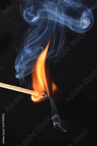 burned match stick on black