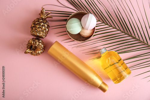 Set of cosmetic products with decor on color background