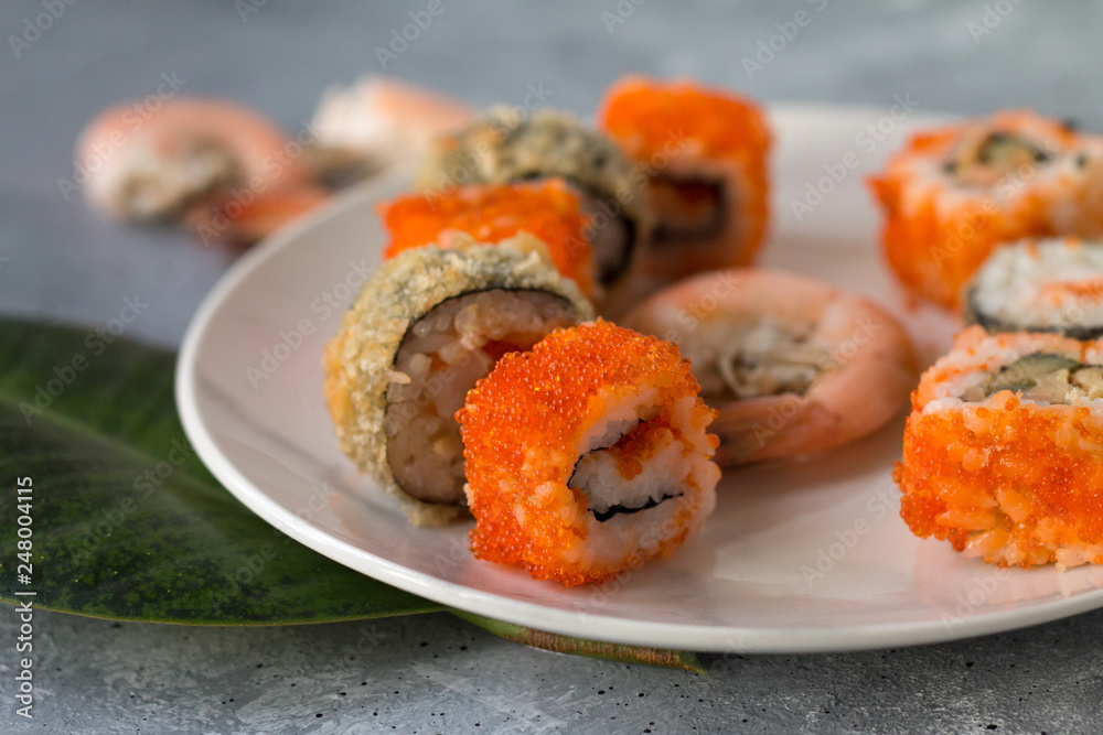 delicious sushi rolls with fresh fish caviar and soy sauce useful
