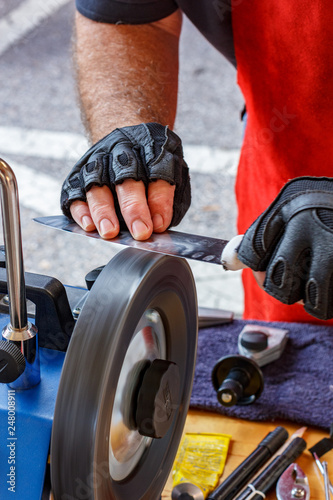 Stropping wheel for final polishing of sharpened knife photo