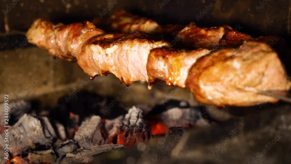 cinemagraph of fat drops from juicy pieces of meat,loseup cinemagraph of fat drops from juicy pieces of meat,loseup