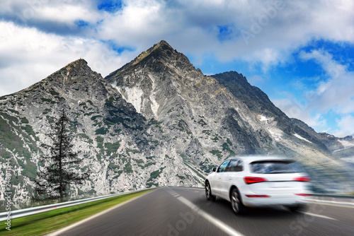 White car moving on highway. Added motion effect. © Denis Rozhnovsky