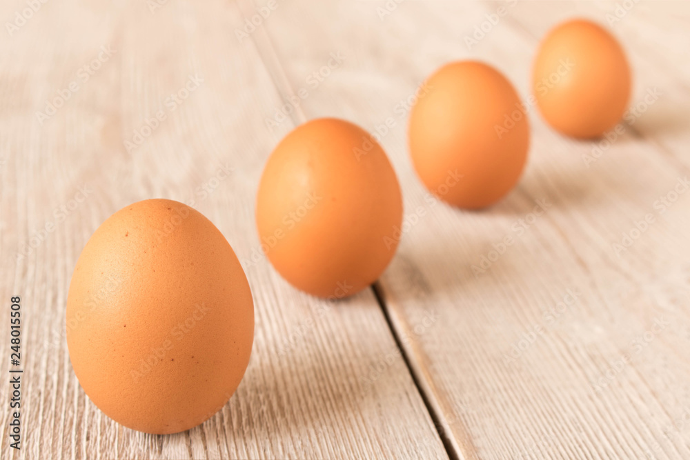Chicken eggs on a wooden table. Selective focus. Chicken eggs on a wooden table. Selective focus.
