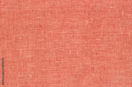 Canvas, coral color, burlap with visible texture. Close Up of jute, texture pattern for background
