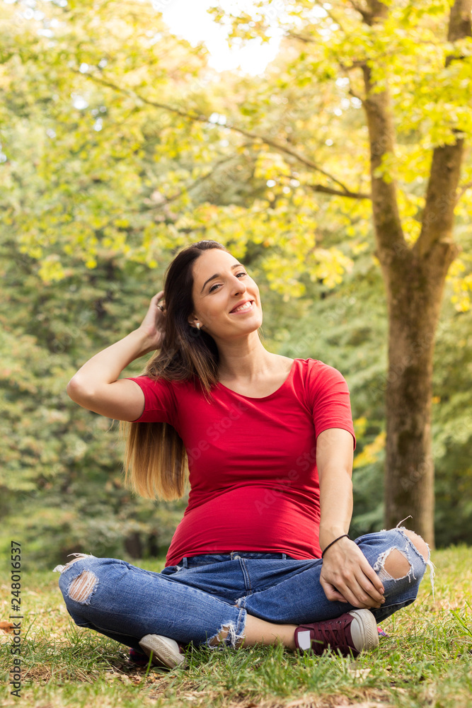 Smiling pregnant woman enjoying the fresh air Smiling pregnant woman enjoying the fresh air