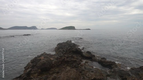 The coast in the sea of Santa Eulalia a cloudy day, Ibiza photo