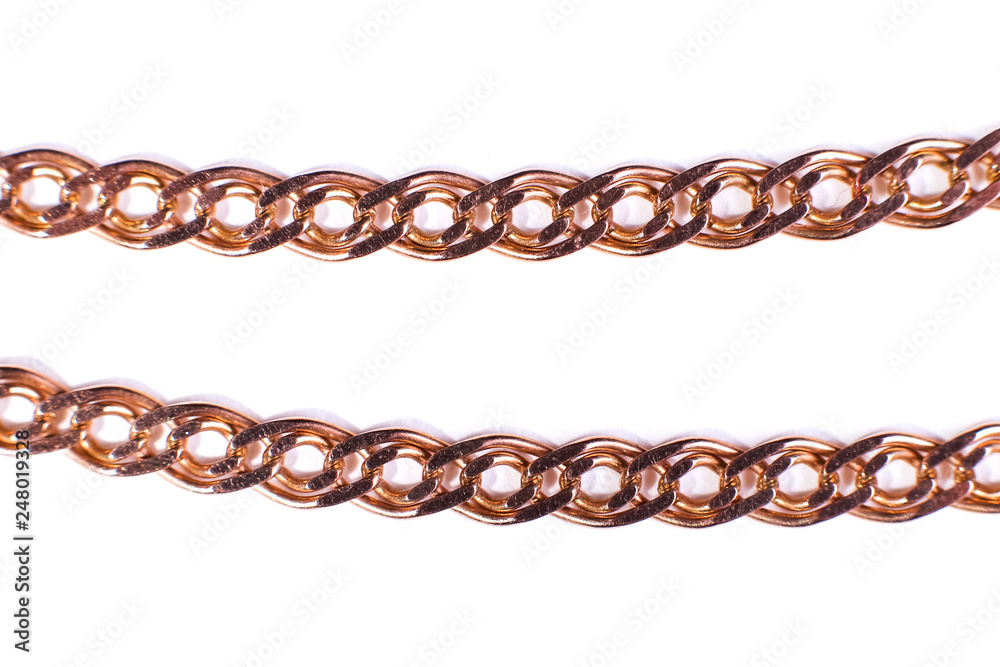 Golden chain weaving non, on a white background. Isolate, macro, soft focus. Golden chain weaving non, on a white background. Isolate, macro, soft focus.