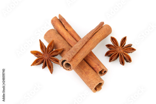 Dry stars anise fruit and cinnamon sticks isolated on white background