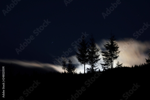 Fool moon landscape with mist and low clouds 