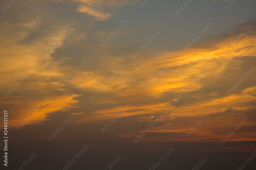 yellow golden clouds in the evening dark blue sunset sky
