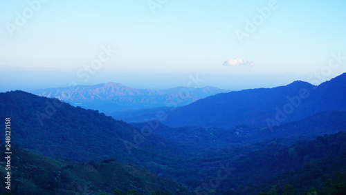  Mountain sunrise landscape in Minca, Colombia. Blue tones, endless mountains view before the sun is up