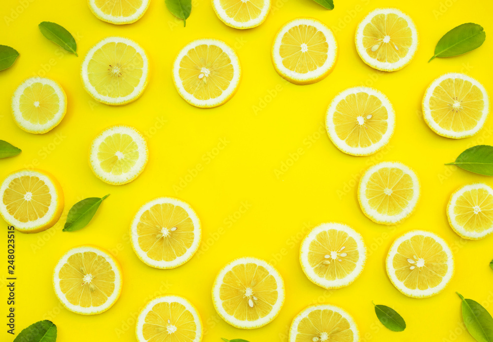 Top view of lemon and leaves on yellow color background.concepts ideas of fruit