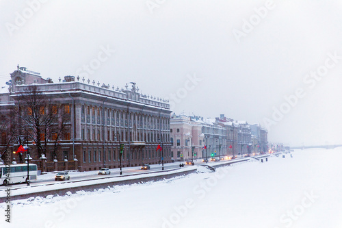 Embankment of a frozen river Neva on a winter day. St. Petersburg. Russia