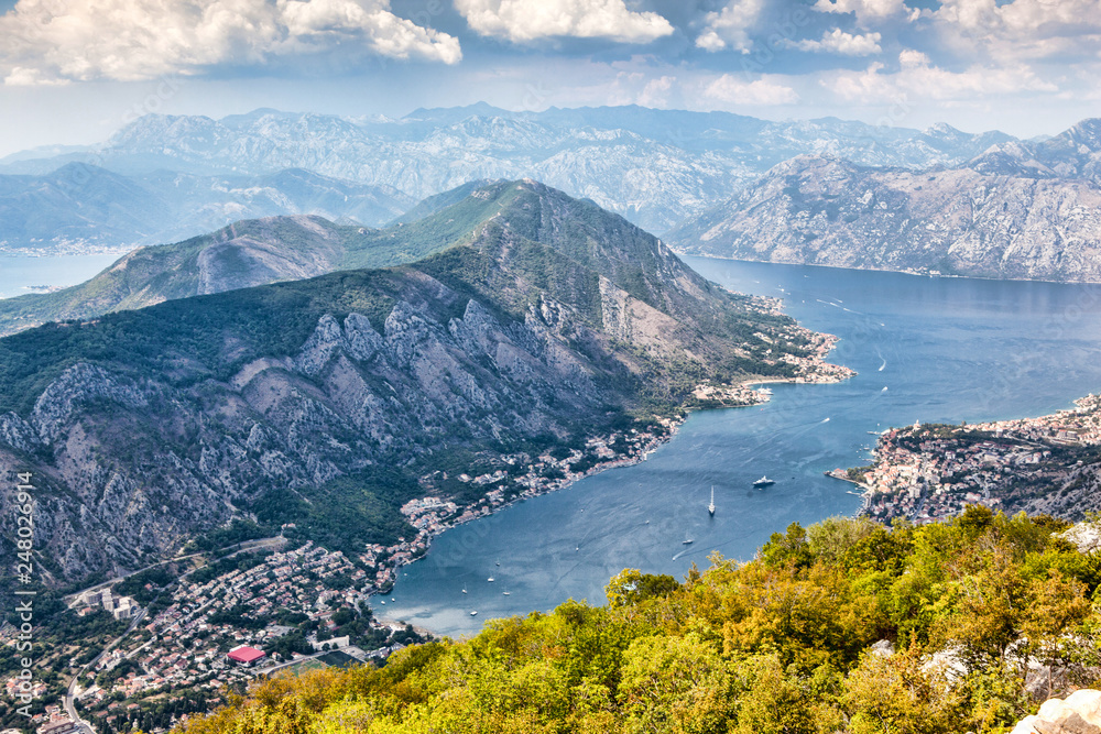 Panoramic view of the airport runway near the city, on the Adriatic Sea, from a great mountain height. Aerial view of Tivat, Kotor Bay, Montenegro.
