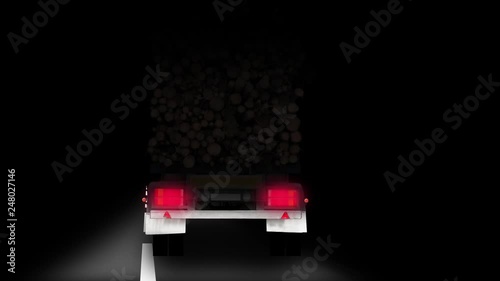 Rear view of wobbling timber truck on road at night