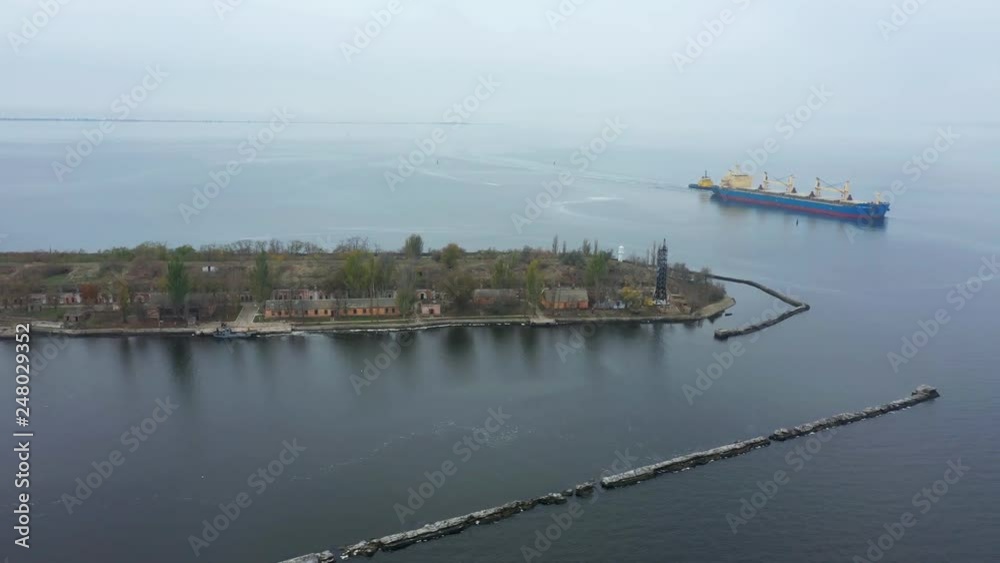 Cargo barge goes on a calm sea. Aerial view Cargo barge goes on a calm sea. Aerial view