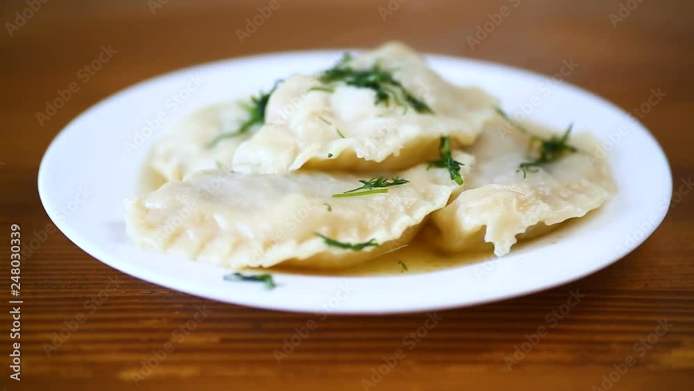 Boiled dumplings stuffed in a plate, Ukrainian national dish. Boiled dumplings stuffed in a plate, Ukrainian national dish.
