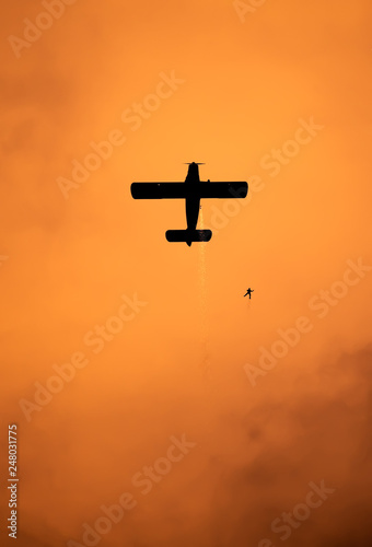 Airplane silhouette in the sky at sunset time during air show BIAS , Bucharest , Romania 