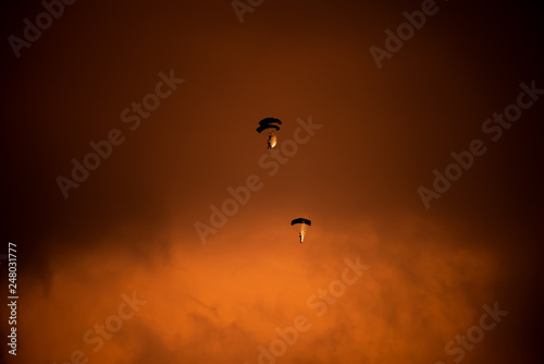 Parachute silhouette a t sunset time during Bucharest BIAS air show 