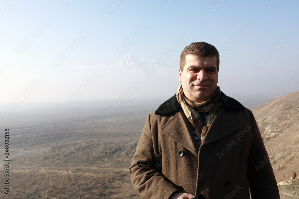 Man on background of Ararat Valley Man on background of Ararat Valley