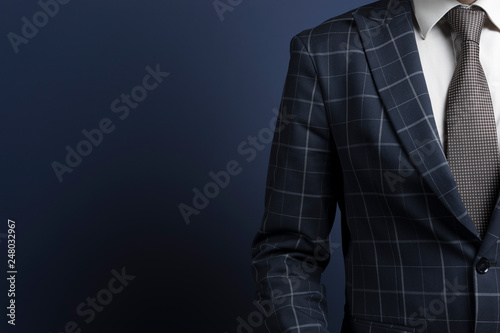 Fototapeta Checkered suit and brown tie